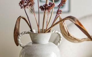 glazed white vase with Autumn Flowers in lifestyle photo