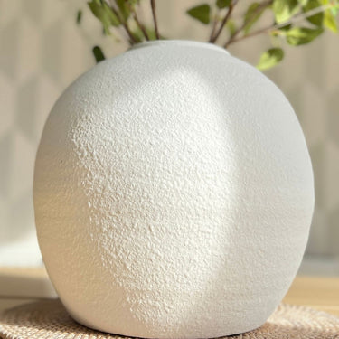 Vase in white cement