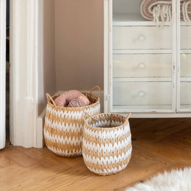 Hand woven natural and white basket in lifestyle photo