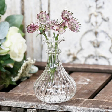 Glass bud vase with ribbed etching in lifestyle photo