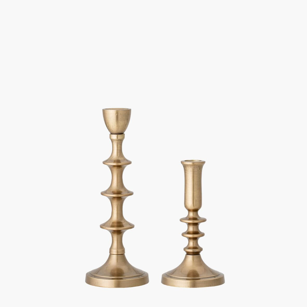 Brass Candlesticks with design in 2 heights on white background