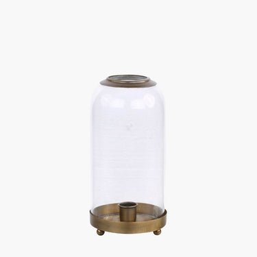 Glass bell and bronze candle holder on feet on white background