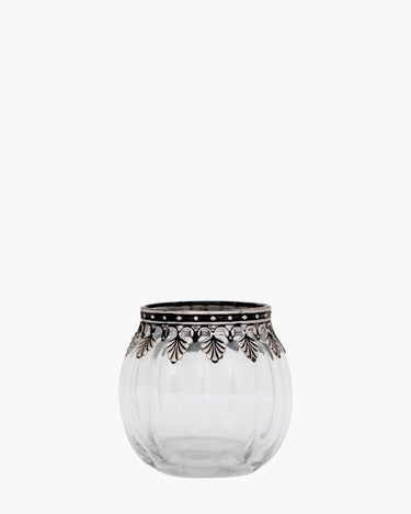 Glass tealight holder with silver leaf edging on white background