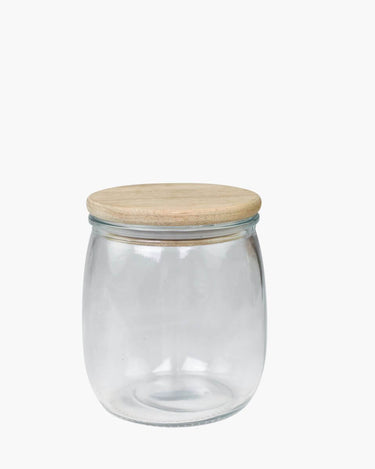 Glass storage jar with wooden lid on white background