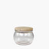 small storage jar with wooden lid on white background