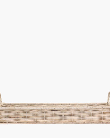 Long wicker basket with handles on white background