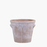 Terracotta pot with rustic edges on white background