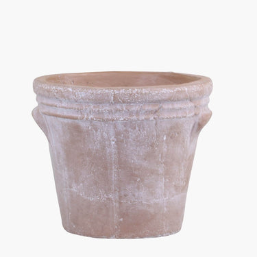 Terracotta flower pot with rustic grooves on a white background