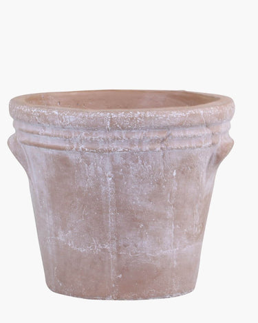 Terracotta flower pot with rustic grooves on a white background