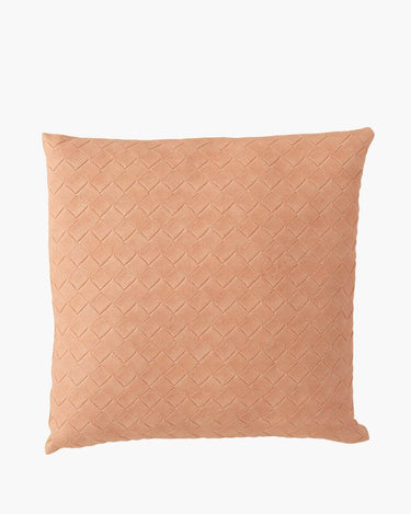 Pink faux leather woven cushion on white background