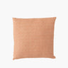 Pink faux leather woven cushion on white background