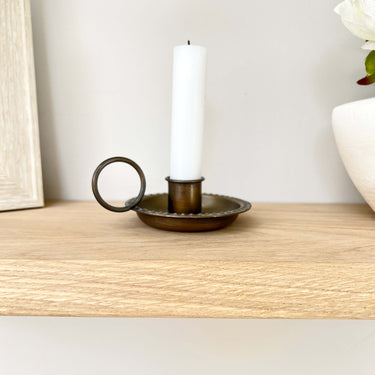 Bronze chamberstick with handle in lifestyle photo