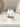 bunch of  7 short white dinner candles in lifestyle photos