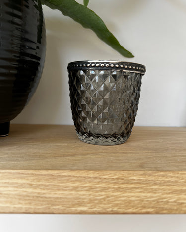 smoked glass tealight holder with silver pearl edge in lifestyle photo