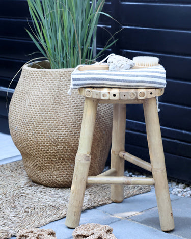 Bamboo stool with flat top in lifestyle photo