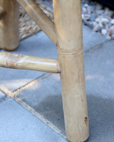 close up leg of bamboo stool in lifestyle photo