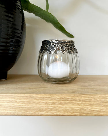 Round glass tealight holder with silver leaf etching on lifestyle photo