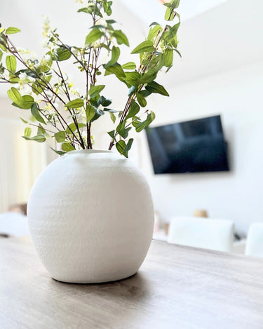 Large white cement vase in lifestyle photo
